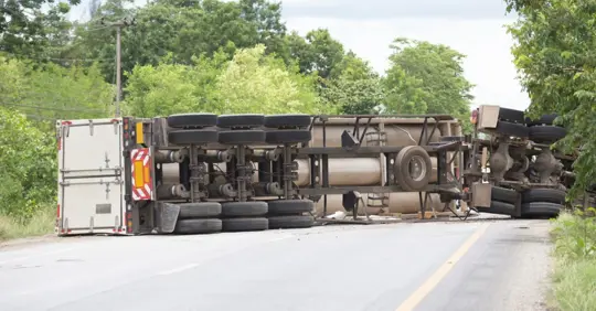 Semi-truck on its side after an accident